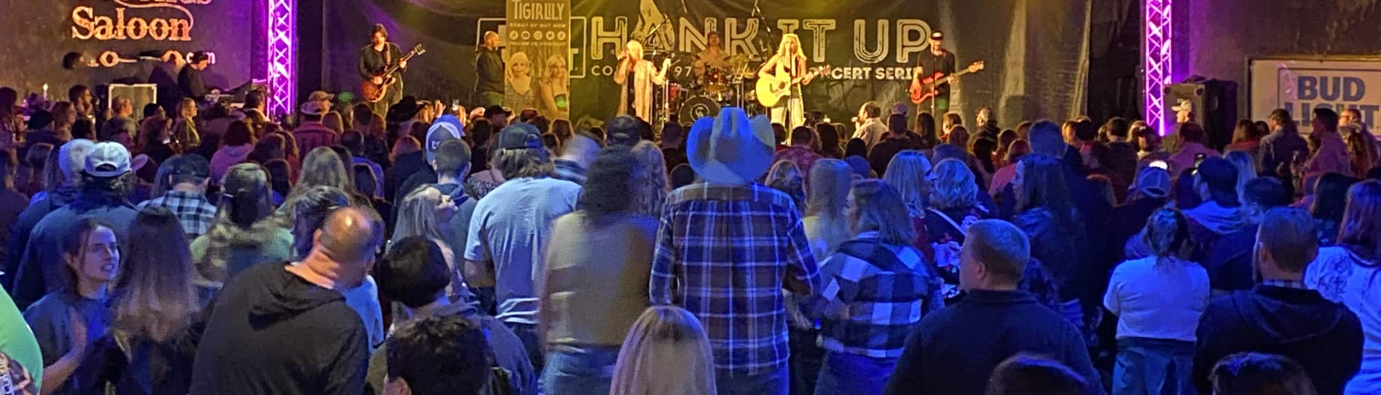 country concert with fans wearing cowboy hats Harrisburg